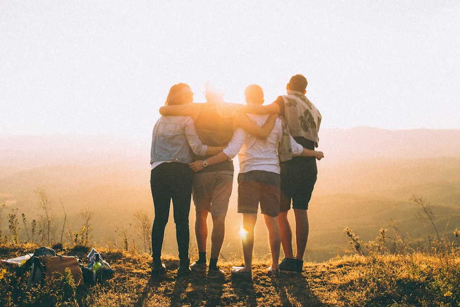 Friends sharing a moment at sunset